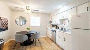 Coffee/tea maker, cookware/dishes/utensils, dining tables - Near K-State Campus - Central Manhattan Stay (Manhattan)