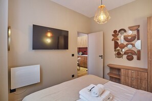1 bedroom, desk, iron/ironing board, bed sheets
