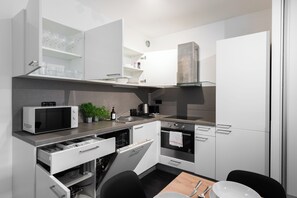 Apartamento conforto, vista para a cidade | Cozinha privada
