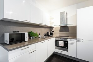Apartamento conforto, vista para a cidade | Cozinha privada