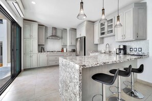Fridge, microwave, oven, stovetop - @ Marbella Lane – Premium Ocean View Villa & Pool (Cabo Bello)