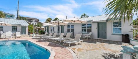 Outdoor pool, a heated pool, pool umbrellas, sun loungers