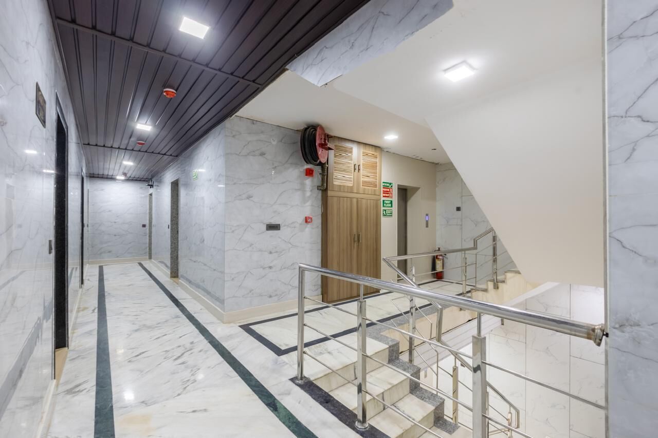 Deluxe Double Room, City View | Living area | 43-inch LED TV with cable channels