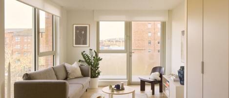 Comfort Apartment | Living area | 36-inch Smart TV with digital channels