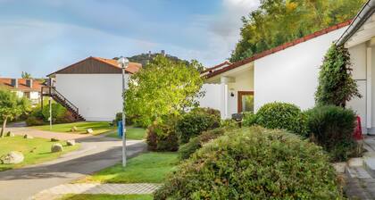 Ferienhaus 25 mit Gemeinschaftsterrasse, privatem Garten und WLAN