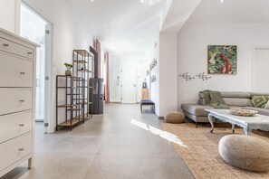 A modern living room with a sofa, coffee table, and decorative items. - Casa Debora for 5 people in the Mongo area (L'Escala)
