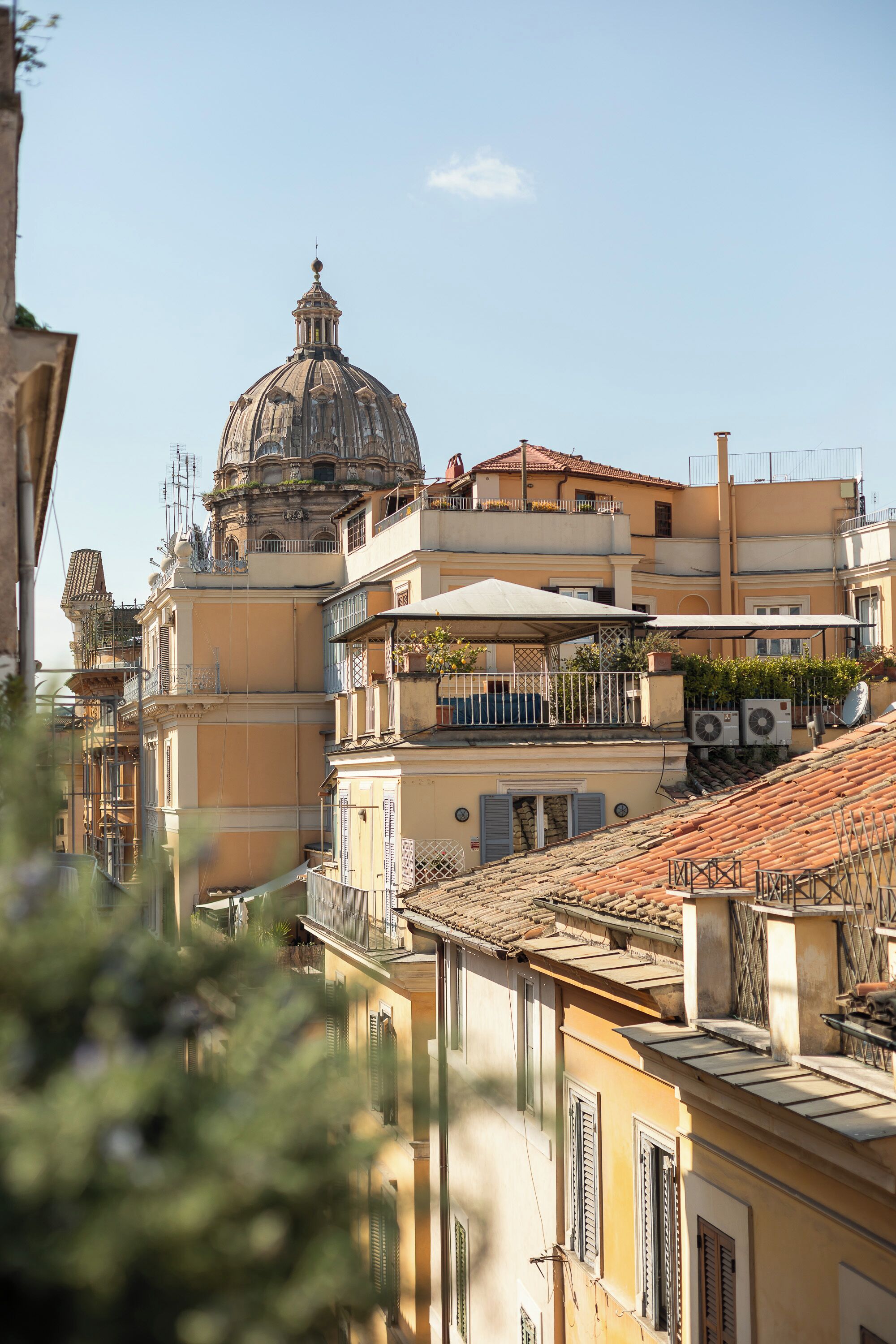 A historic building with a prominent dome and multiple balconies.