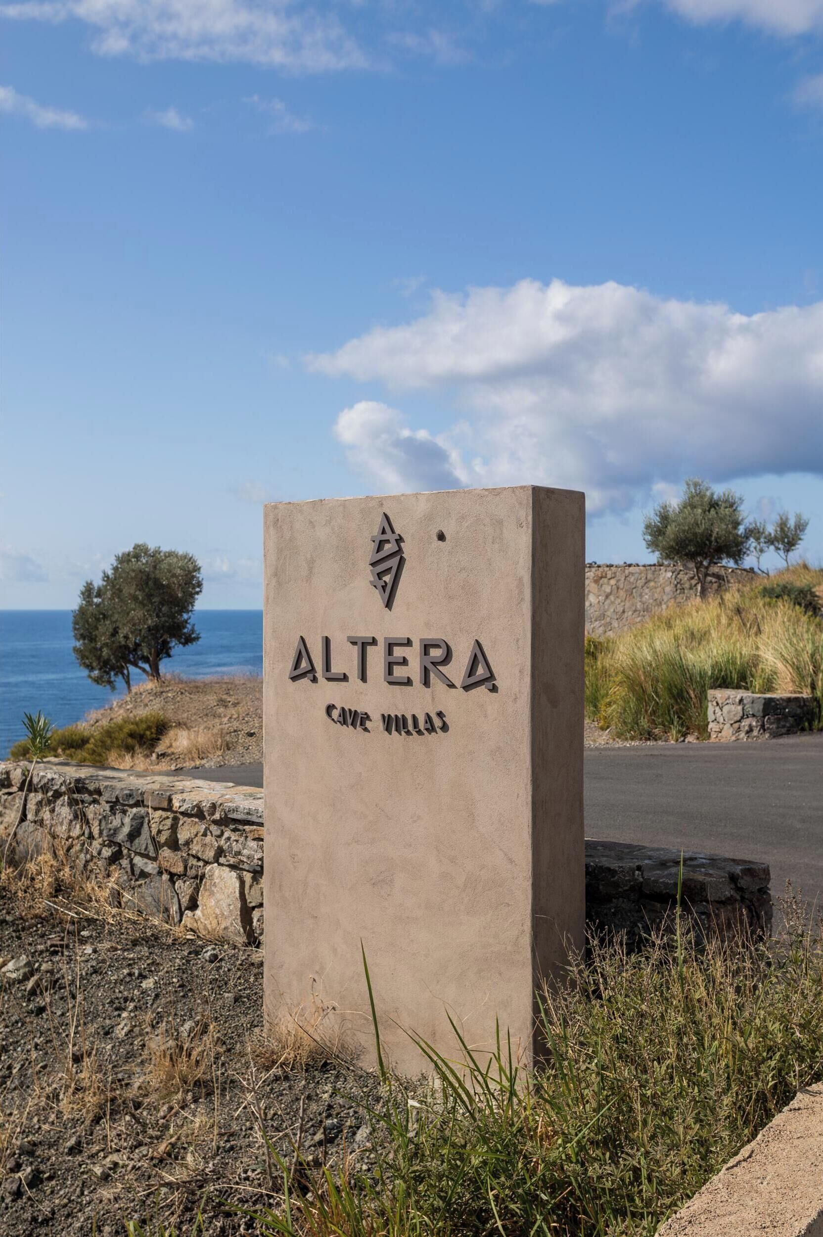 A concrete sign with the name "ALTERA" and "Cave Museum" indicating a location.