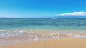 A beach with clear blue water and a sandy shore. - SUMMER SALE! Oceanfront 1BD Condo with Sunset & Whale Views - Royal Kahana 1206 (Lahaina)