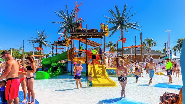 A water park with slides, pools, and palm trees. - Z35 Absolutely beautiful 2 bedroom 2 bath Ocean Lakes! (Myrtle Beach)