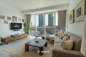 Living room - Manzil - Modern 1BR w Stunning Lake View (Dubai)