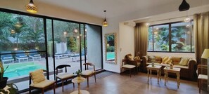 32-inch Smart TV with digital channels, books - The Sage Morjim - Boutique Stay Near Morjim Beach, Goa (Morjim)