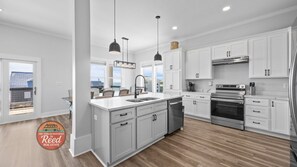 Fridge, microwave, oven, stovetop - Coastal Comfort — Luxurious New Construction with Stunning Gulf Views (Gulf Shores)