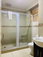 Shower, rainfall showerhead, towels, soap