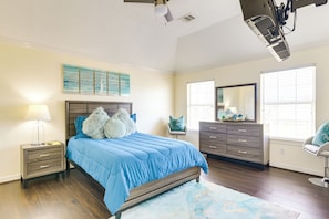 A bedroom with a bed, nightstands, a dresser, a chair, and a ceiling fan. - Fenced Yard, < 2 Mi to Dtwn Houston: Family Home! (Houston)