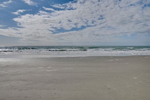 A beach with a clear sky and ocean waves. - Spacious Home w/ Oceanside Village Resort Perks! (Murrells Inlet)