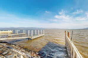 A pier extending into a body of water with a clear sky above. - Forbestown Carriage House in the Heart of Dtwn (Lakeport)