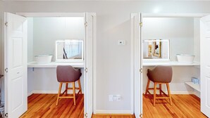 A room with two white desks, each with a computer, a chair, and a window. - 4BR Waterview Home w/ Pool, Fire Pit & Fishing (Griffin)