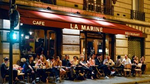 A cafe named "La Marine" with outdoor seating and a red awning. - AN IDEAL BLEND OF COMFORT, PARISIAN CHARM-JUST STEPS FROM PLACE DE LA RÉPUBLIQUE (Paris)