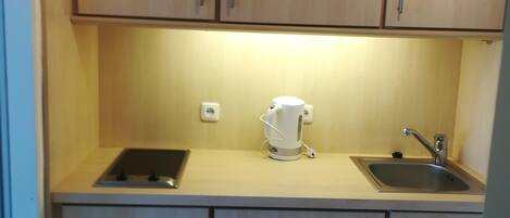 Fridge, microwave, stovetop, coffee/tea maker