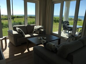 TV, fireplace - Relaxing vacation in the first row on the beach - vacation apartment with sea view! (Fehmarn)