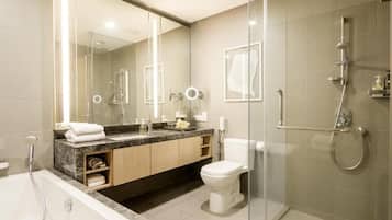 Separate tub and shower, hair dryer, slippers, towels