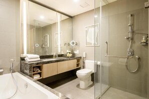 Separate tub and shower, hair dryer, slippers, towels - Signature Apartment at 188 Suites (Kuala Lumpur)