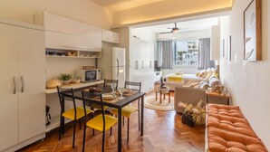 A modern apartment with a dining area, kitchen, and living space. - 300 Meters From Copacabana Beach Nsc909 (Rio de Janeiro)