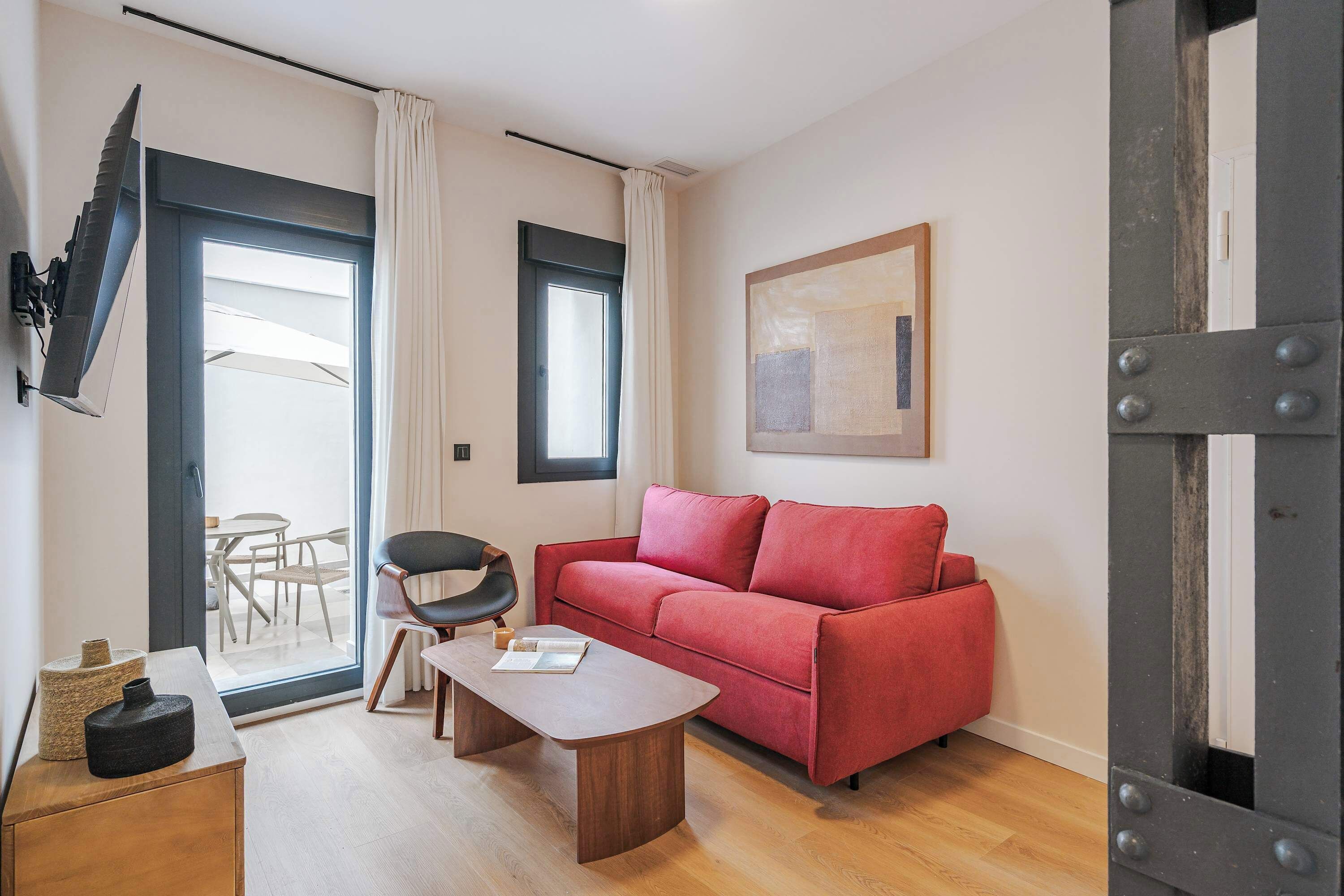 Basic Apartment, Patio | Living area | 60-cm TV with cable channels