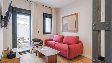 Basic Apartment, Patio | Living area | 60-cm TV with cable channels