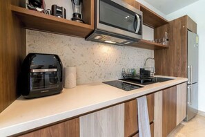 Fridge, microwave, stovetop, coffee/tea maker