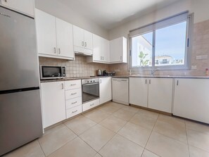 Fridge, microwave, oven, stovetop - Pernera Seaside Villa - Sun, Sea, Poolside Bliss (Protaras)