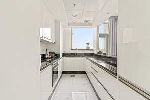 Private kitchen - FIRST CLASS | 2BR | Luxe Canal View Haven (Business Bay)