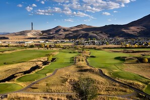 A golf course with a clear view of the surrounding town and mountains. - Enjoy Yellowstone Nature Trails in Cabin with Kitchenette and Fire Pit (Anaconda)