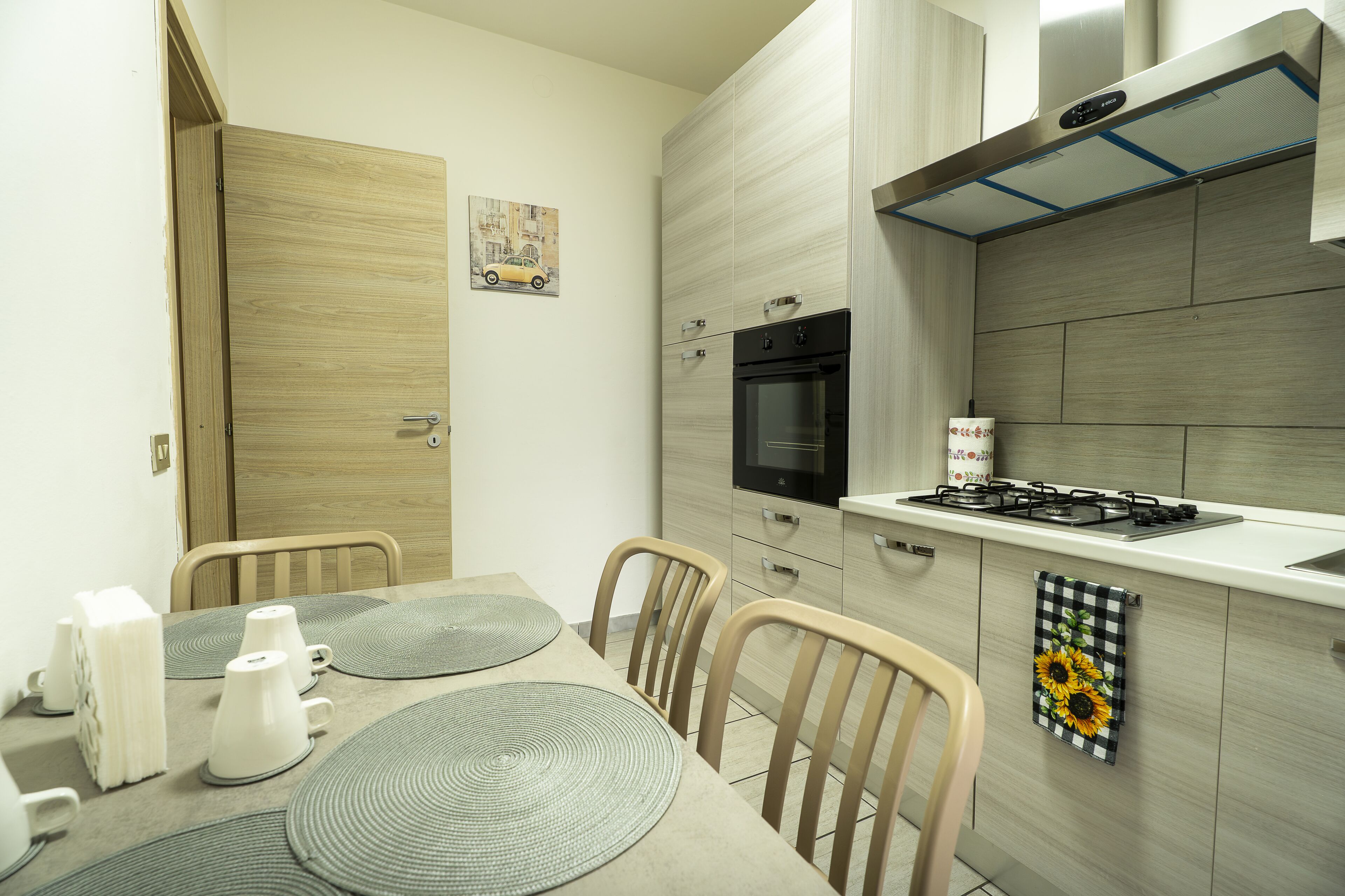 Fridge, coffee/tea maker, cookware/dishes/utensils, dining tables