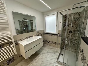 Shower, hair dryer, bathrobes, towels