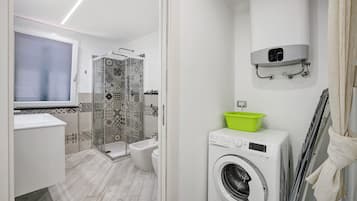 Shower, hair dryer, bathrobes, towels