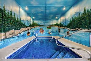 An indoor swimming pool with a mural of a forest and mountains. - Firefly Haven Private Indoor Pool, Hot Tub & Game Room Near Dollywood (Pigeon Forge)