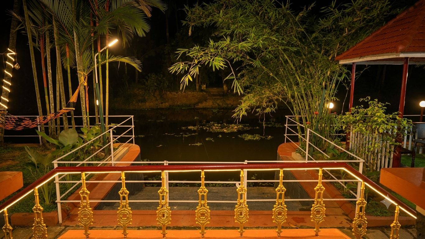 A nighttime outdoor area with a wooden deck, a pond, and surrounding vegetation.