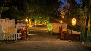 A gated entrance to a property with a sign indicating a heritage rongan. - Backwater Retreat Resort - Kumarakom (Kottayam)