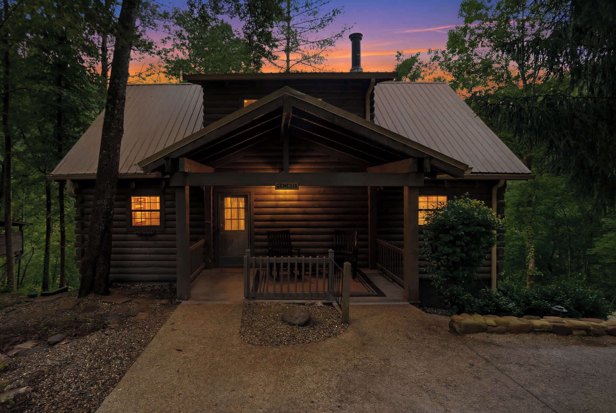 A log cabin with a porch, a chimney, and a sign that reads 'GENESIS.'