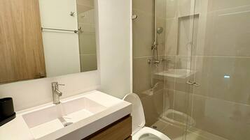 Shower, hair dryer, towels, soap