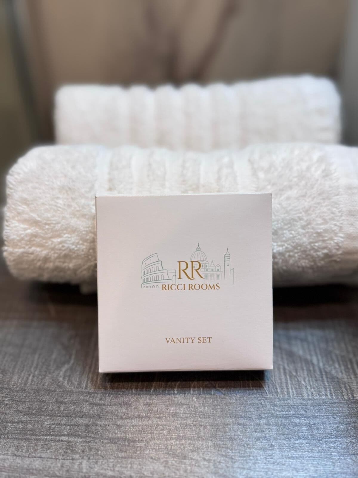 A white box with 'RR Ricci Rooms Vanity Set' text and a logo.