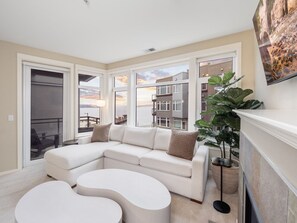 TV, fireplace - Puget Sound Views Elegant 2BR Walk to Pike Place (Seattle)