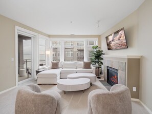 TV, fireplace - Puget Sound Views Elegant 2BR Walk to Pike Place (Seattle)