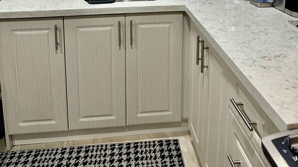 A kitchen with light wood cabinets, a stainless steel sink, a microwave, and a coffee maker. - Family style cozy living in friendly surroundings (Ajax)