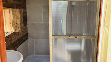 Shower, towels, soap, toilet paper