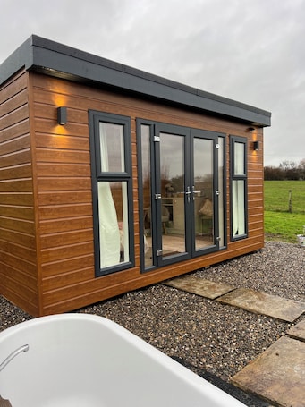 Property grounds. Cosy off-grid countryside cabin.