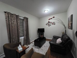 Suite, 2 Bedrooms | Living area - Mjd Place & Executive Suites (West Nipissing)