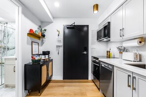 Fridge, microwave, oven, stovetop - The McCaul | Cozy Basement Studio in Heart of DT (Toronto)